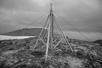 Low angle view of rope on land against sky