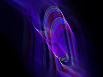 Close-up of light painting against black background