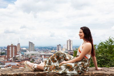 Beautiful young woman at the san antonio hill located in the city of cali in colombia