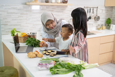 High angle view of people having food at home