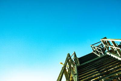 Low angle view of building against clear blue sky