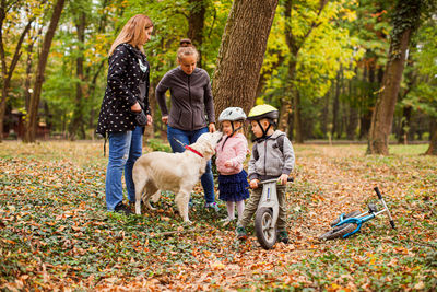 Full length of mother with kids at park