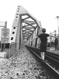 People walking on railroad track