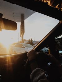 Man seen through car window