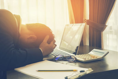 Tired businessman relaxing at office