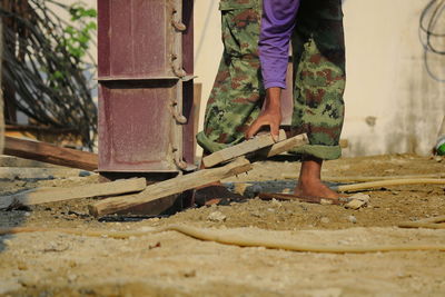 Low section of man working on wood