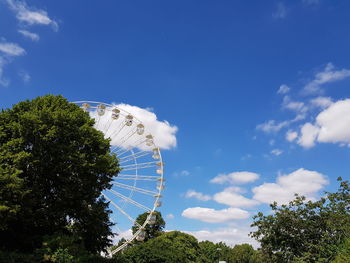 Low angle view of ferris wheel against sky