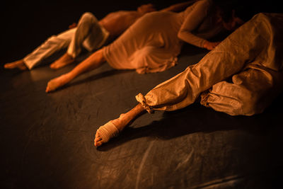Low section of ballet dance lying on stage