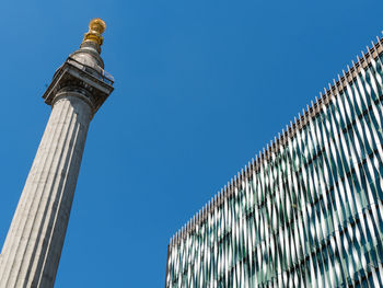 Low angle view of building against blue sky