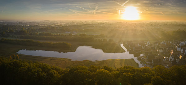 High angle view of dutch village in fog at sunrise