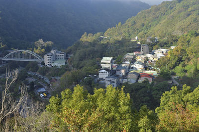 High angle view of townscape and trees in city