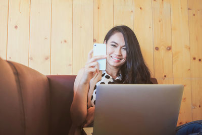 Young woman using mobile phone