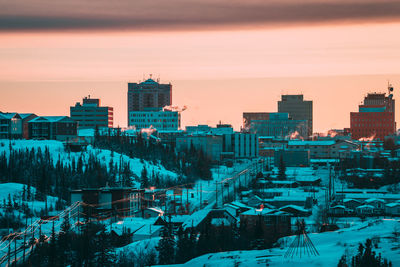 High angle view of buildings in city during winter