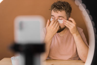 Young man using mobile phone