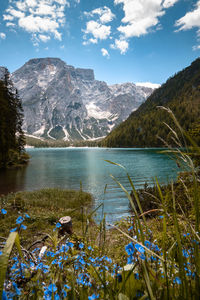 Scenic view of lake and mountains against sky