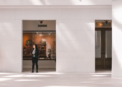 Woman standing in front of building