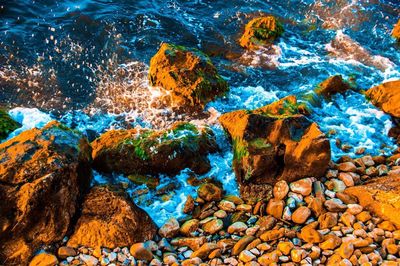 High angle view of rocks in water