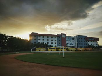 View of buildings against cloudy sky