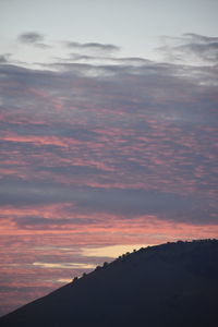 Low angle view of dramatic sky during sunset