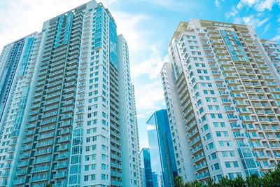 Low angle view of modern buildings against sky