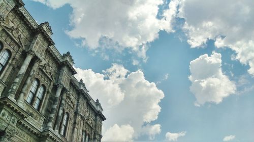 Low angle view of building against cloudy sky