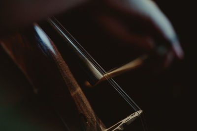 Cropped image of hand playing violin