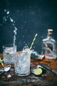 Glass of drink on table