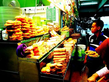 Man for sale at market stall