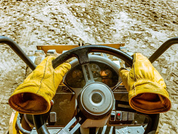 Empty gloves driving tractor