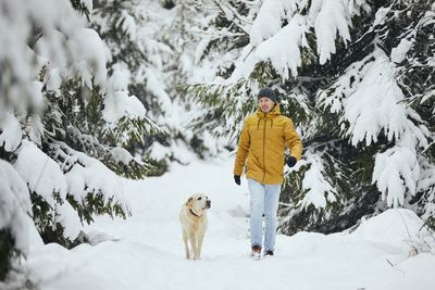 Man with dog in snow