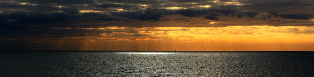 Scenic view of sea at sunset