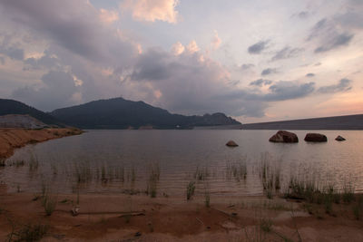 Scenic view of lake against sky during sunset