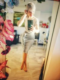 Full length of girl standing on floor at home