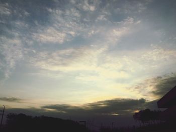 Scenic view of landscape against sky at sunset