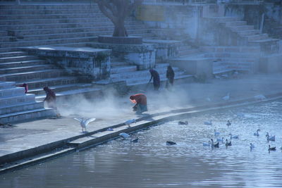 High angle view of women cleaning by river
