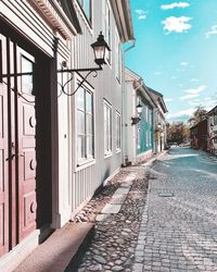 Alley amidst buildings in city