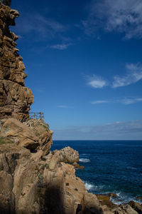 Scenic view of sea against blue sky