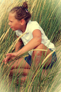 Woman standing on grass