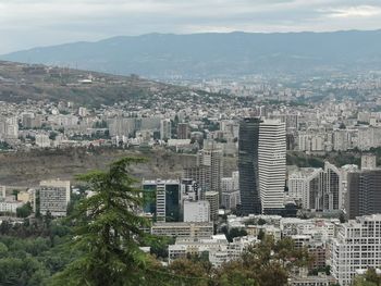 High angle view of buildings in city against sky