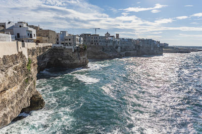 Rough and breathtaking sea. polignano a mare sunlit. puglia. italy