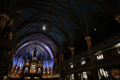 Low angle view of illuminated ceiling