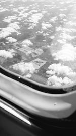 Close-up of car windshield against sky