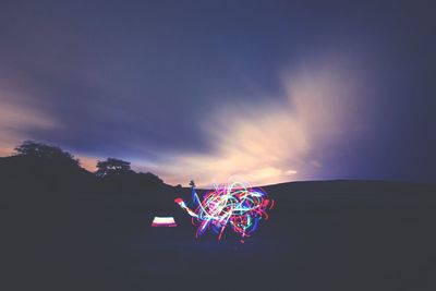 Multi colored lights against sky