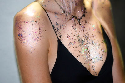 Midsection of woman with glitter