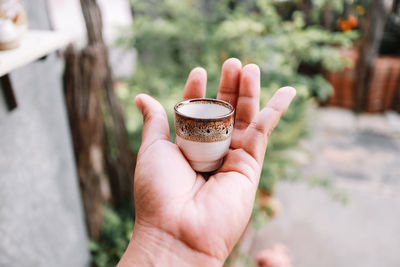 Close-up of hand holding drink
