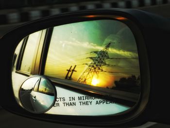 Reflection of car on side-view mirror
