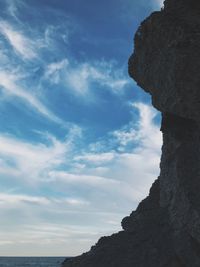 Low angle view of rock formation against sky