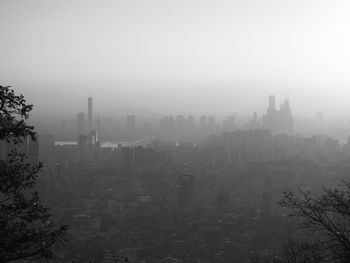 High angle view of buildings in city against sky
