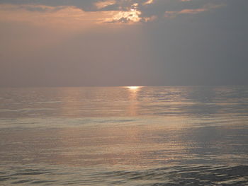 Scenic view of sea against sky at sunset