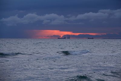 Scenic view of sea against dramatic sky
